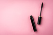 Mascara on pink background. Basic products for eyelashes makeup.