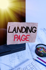 Fototapete - Text sign showing Landing Page. Business photo showcasing Web page that a user arrives at after clicking a hyperlink Note paper taped to black computer screen near keyboard and stationary