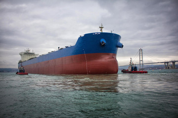 Poster - launching of renovated tanker cargo ship from dock to water.