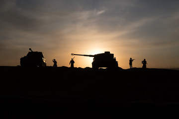 War Concept. Military silhouettes fighting scene on war fog sky background, World War Soldiers Silhouette Below Cloudy Skyline At sunset.