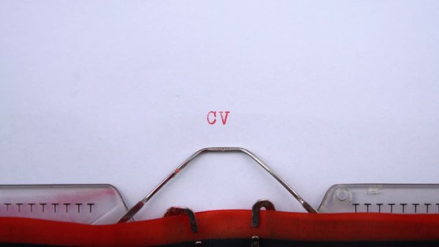 CV - abbreviature (Curriculum vitae) printed on an old typewriter in red letters, close up. vintage inscription