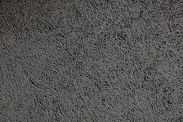 Close up texture of a wall with a grey sound absorbing panel mounted on it. Soundproof wall made of compressed fibers in a sound studio, music salon or club.