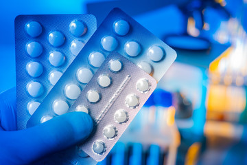 Poster - tablets in packages close-up. pharmacology. development of new medicines. tablets on the background 