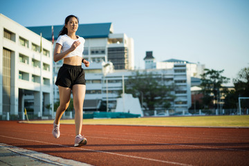 Asian woman runners she exercises in the morning