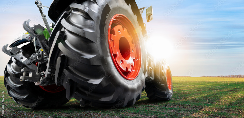 Bottom view of tractor. Close up of wheels - obrazy, fototapety, plakaty 