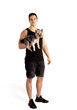 © stalk - young sporty guy with a cute little dog