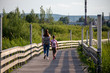 © Majid Gheidarlou - mom and daughter walking on a bridge
