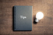 Tips book and Light Bulb