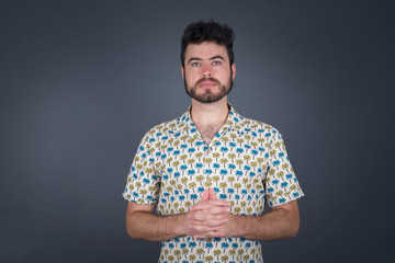 Business Concept - Portrait Handsome Business man holding hands with confident face isolated over gray Background.