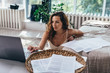 © undrey - Stay at home. Woman working with a laptop sitting on floor