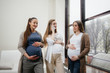 © Andrii - A group of young pregnant girls communicate in the prenatal class. Care and consultation of pregnant women