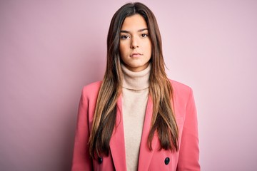 Poster - Young beautiful businesswoman wearing casual turtleneck sweater and jacket with serious expression on face. Simple and natural looking at the camera.