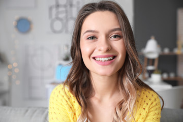 Wall Mural - Young woman using video chat at home