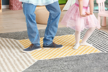 Sticker - Father and his little daughter dancing at home