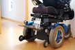 © ins - Blue electric wheelchair for disabled people - indoors