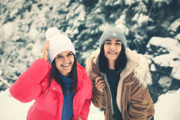 Canvas Print - Friends outdoors on snowy day. Winter vacation