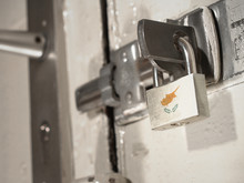 A Bolted Door Secured By A Padlock With The National Flag Of Cyprus On It.(series)