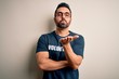 © Krakenimages.com - Handsome man with beard wearing t-shirt with volunteer message over white background looking at the camera blowing a kiss with hand on air being lovely and sexy. Love expression.