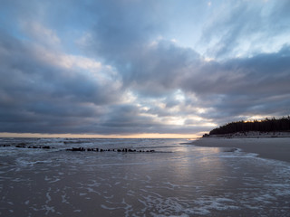 Sunrise at the estuary of the Piasnica River, Poland, Debki. Dramatic sky.