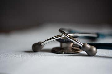 Close up stetthoscope on dark background.