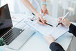 © littlepigpower - Business woman send document to manager in suit for signature on the desk. Business concept.