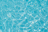 Fototapeta Sypialnia - Blue water ripple reflection in the swimming pool