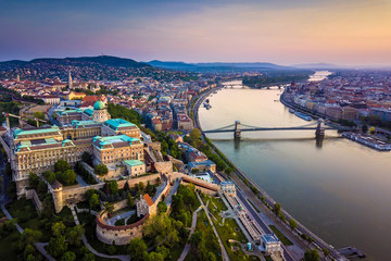 Budapest, Hungary - Aerial skyline view of Buda Castle Royal Palace and South Rondella with Castle District and Szechenyi Chain Bridge at sunrise