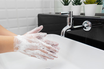 personal hygiene. washing hands, rubbing hand thoroughly with soap that has a lot of bubbles for cleaning and disinfection, prevention of spreading of germs during infections of COVID-19 Coronavirus