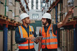 © StratfordProductions - Tensed worker in factory showing shelves to his manager holding digital tablet with hardhat and safety vest