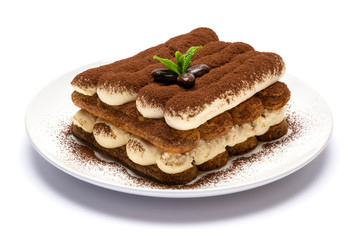 Wall Mural - Classic tiramisu dessert on ceramic plate isolated on white background with clipping path