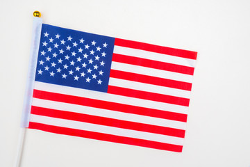 Wall Mural - Flag of the United States of America on a white background. American flag. Official symbol of the United States. Red and white striped banner with stars on a blue background. The star-spangled banner.