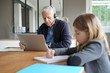 © goodluz - Father and school-girl working form home, telework and e-learning