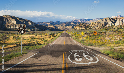 Scenic view of famous Route 66 in classic american mountain scenery at sunset Wallpaper Mural