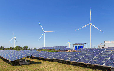 Poster - solar cells with wind turbines generating electricity in hybrid power plant systems station on blue sky background alternative renewable energy from nature  Ecology concept.   