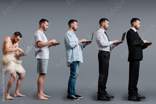 Fotomural collage of caveman, man and businessman using laptop on grey, evolution concept