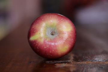 Fresh red apple isolated on wood background