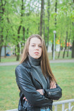 Fototapeta Młodzieżowe - Portrait of beautiful girl in city park
