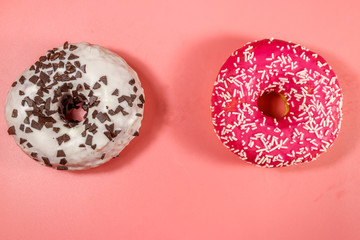 Tasty donuts on pink background. Top view