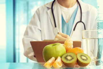 Healthcare And Medicine. Doctor with fruits