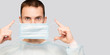 © Svetlana - Portrait of young man wears protective mask and protective suit against air pollution or transmissible infectious diseases isolated on white