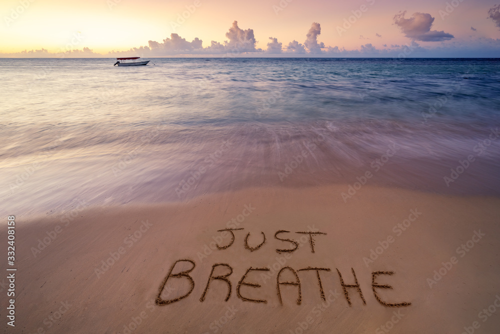 handwritten Just breathe on sandy beach - obrazy, fototapety, plakaty 