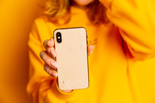 Broken Phone In Woman's Hand. Sad Lady Holding Broken Glass And Mobile