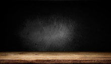 Selected Focus Empty Brown Wooden Table And Wall Texture Or Old Black Brick Wall Blur Background Image. For Your Photomontage Or Product Display
