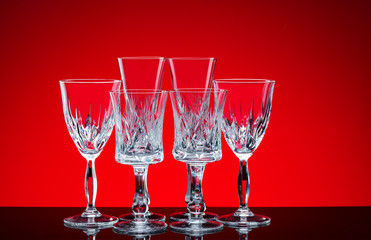 crystal glasses shot close-up on a red background