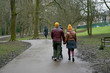 © Bryony - Couple walking in city park, UK