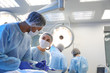 © New Africa - Team of professional surgeons performing operation in clinic