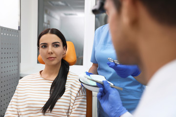 Canvas Print - Professional doctors examining patient before surgery in clinic