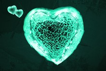 Thank You. I Stay At Home. One Big And Two Small Green Glowing Hearts. Symbol For Healthcare Professionals Taking Care Of Us During A Coronavirus Pandemic.