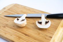 Sliced Mushrooms Champignons On A White Board