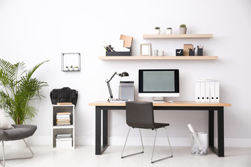 Modern computer on table in office interior. Stylish workplace